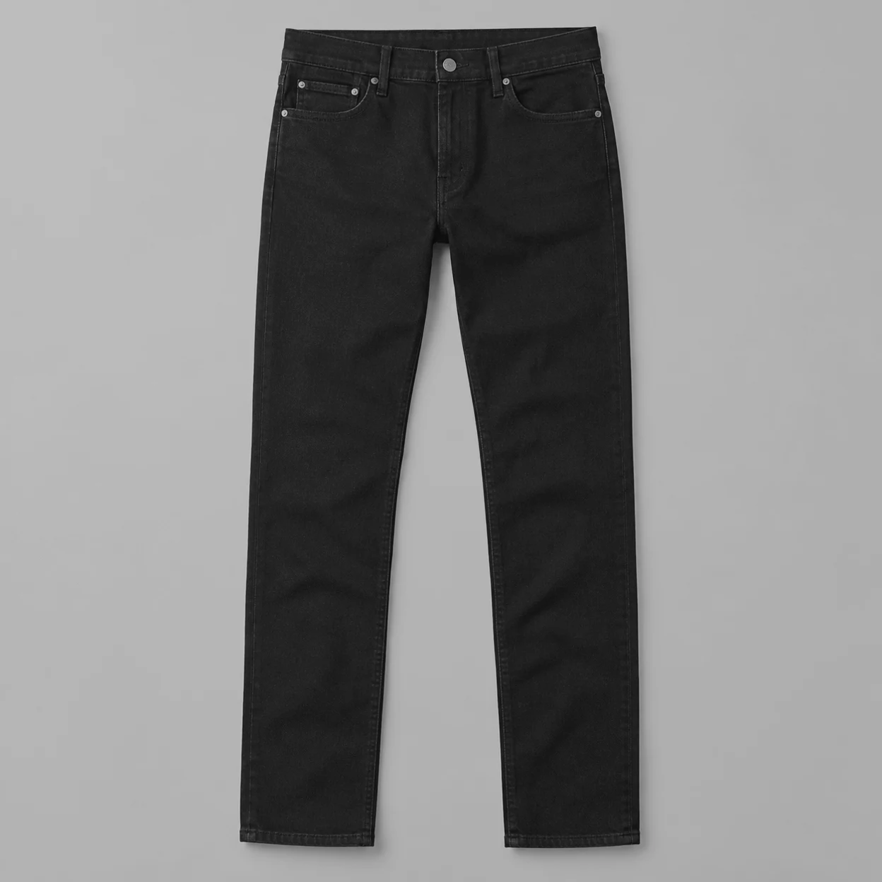 Pair of grey straight-leg jeans laid flat